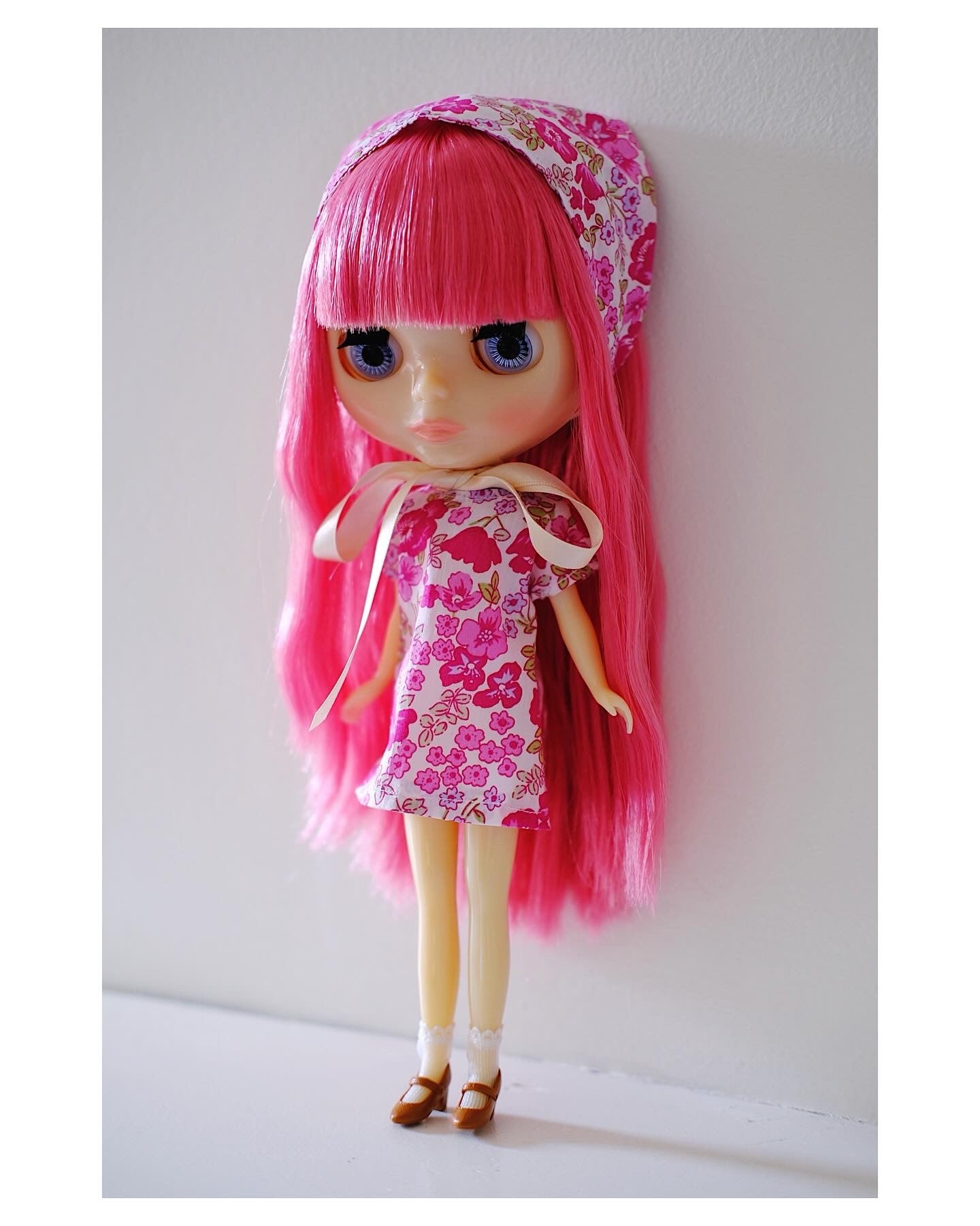 pink blythe doll wearing floral pink unique hand made dress and bonnet headscarf